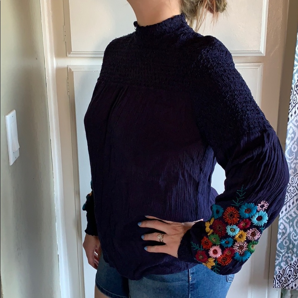 Blue high neck long sleeve with flower detail